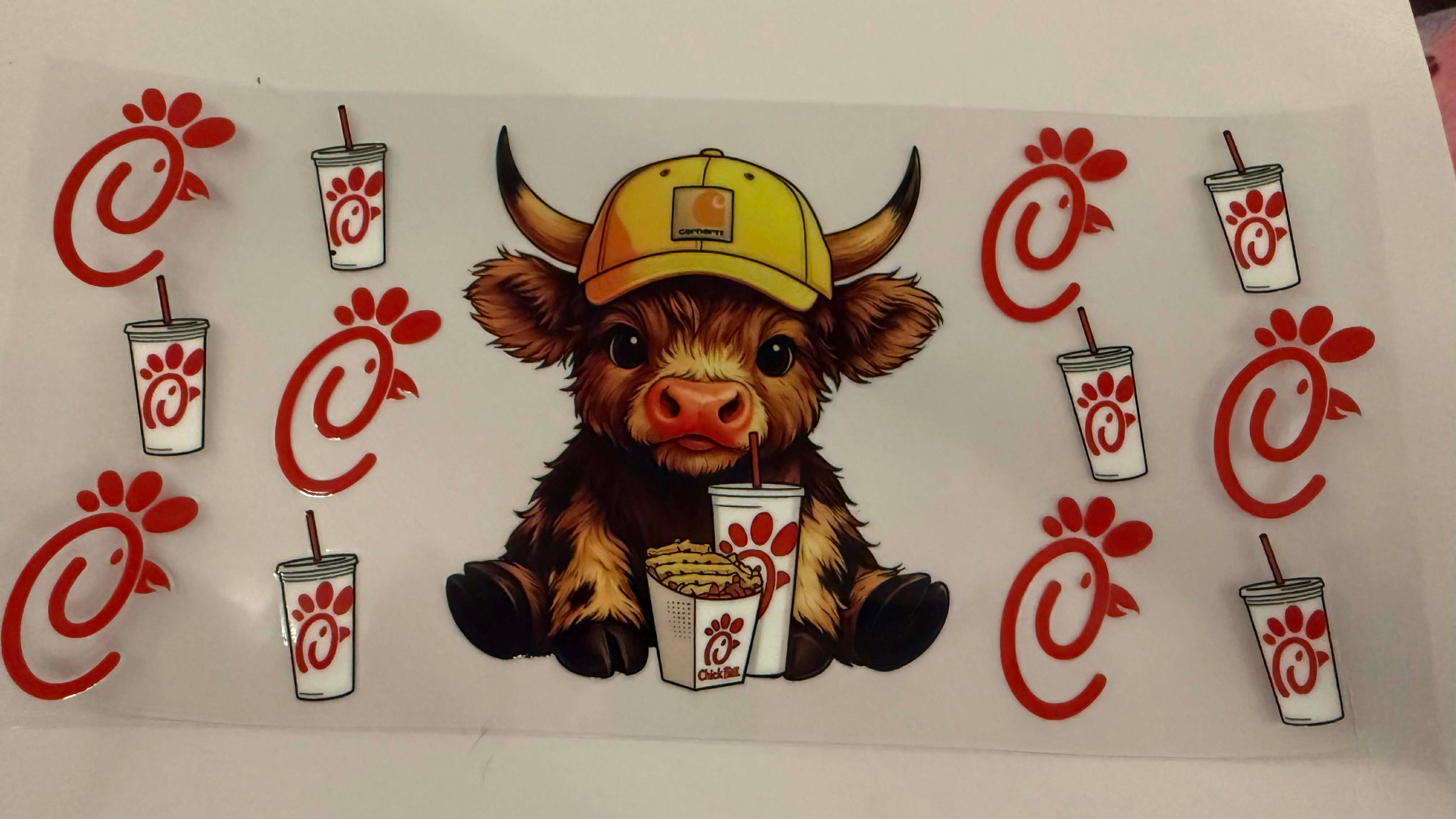 highland cow with chick-fil-a